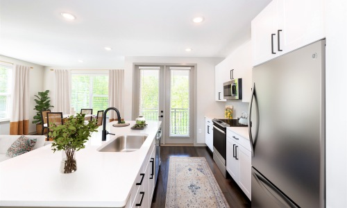 Image of kitchen with large island and stainless steel appliances